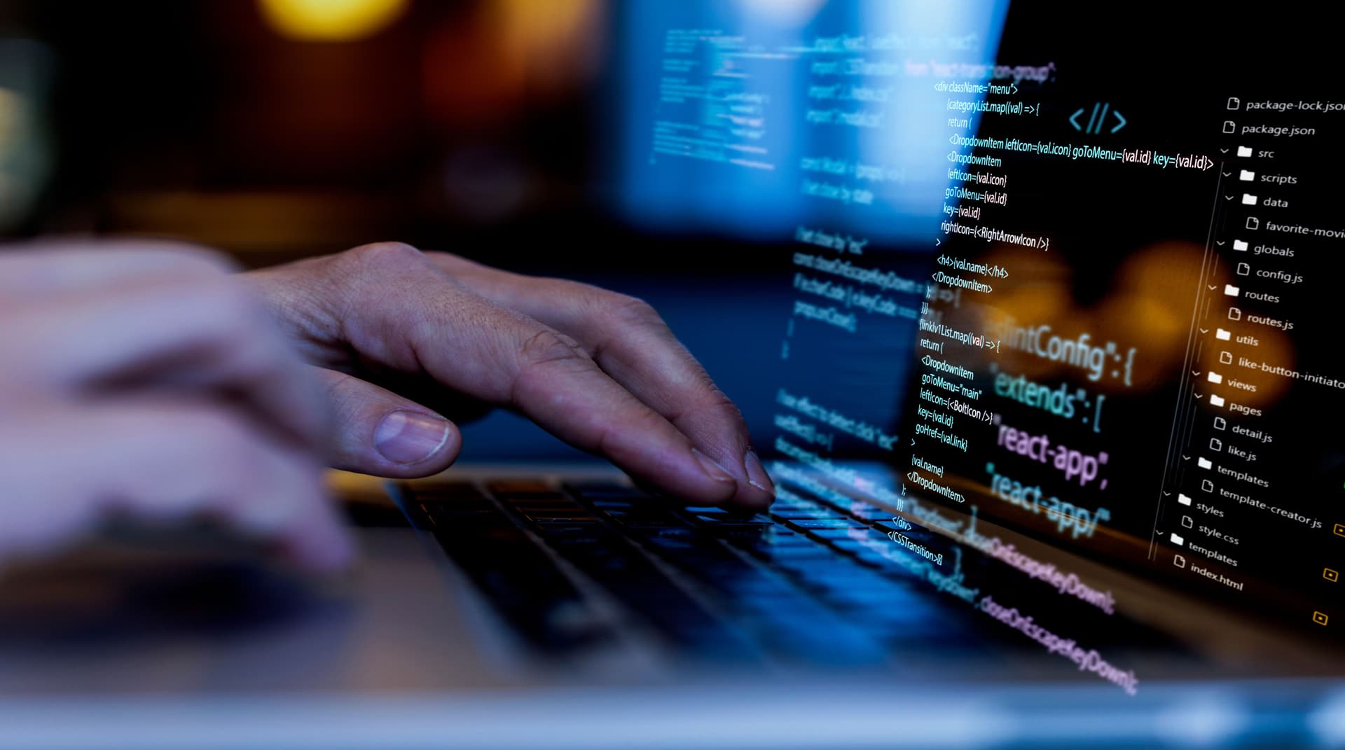 Hands typing on a keyboard with code displayed on screen